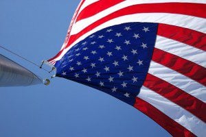 An American flag, fluttering upside down